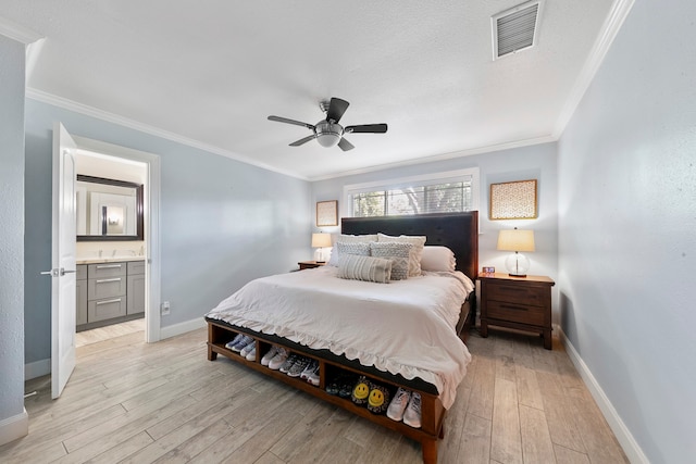 bedroom featuring light hardwood / wood-style floors, crown molding, ensuite bathroom, and ceiling fan