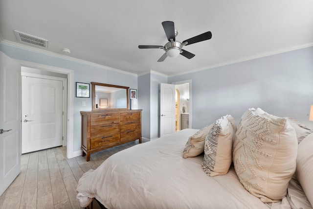 bedroom featuring light hardwood / wood-style floors, crown molding, ensuite bathroom, and ceiling fan