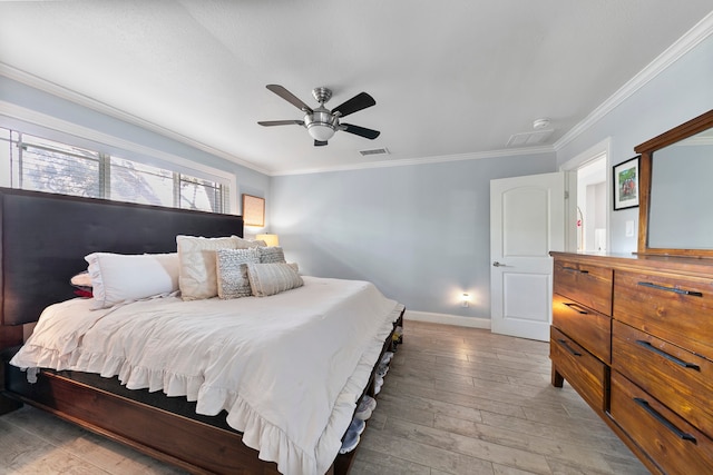 bedroom featuring ceiling fan, crown molding, and wood-type flooring