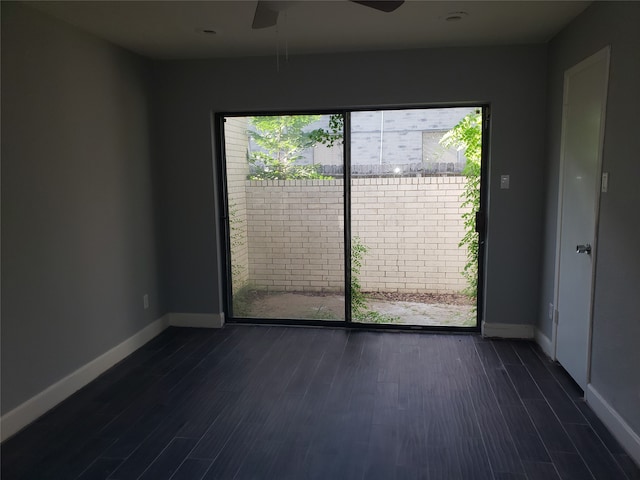 unfurnished room featuring dark hardwood / wood-style flooring, ceiling fan, and a wealth of natural light