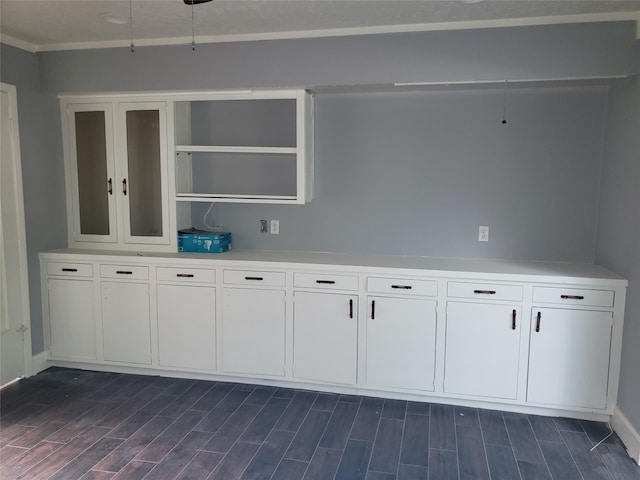 interior space with white cabinetry and dark hardwood / wood-style flooring