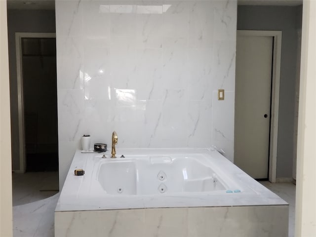 bathroom featuring a relaxing tiled tub