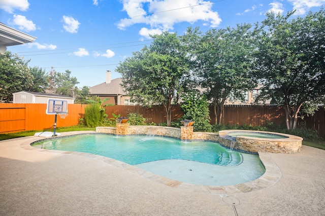 view of swimming pool featuring a patio area, an in ground hot tub, and pool water feature