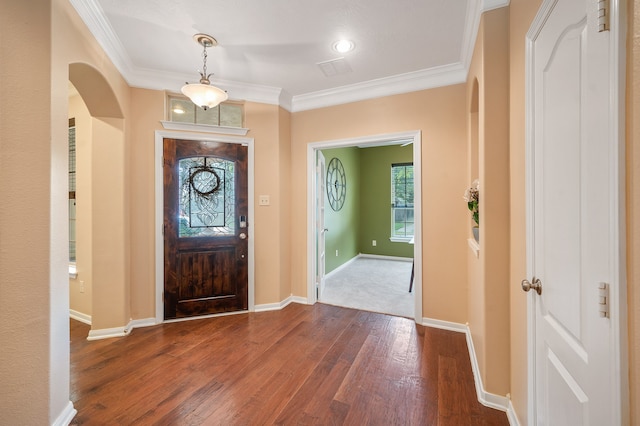 entryway featuring crown molding and dark hardwood / wood-style flooring