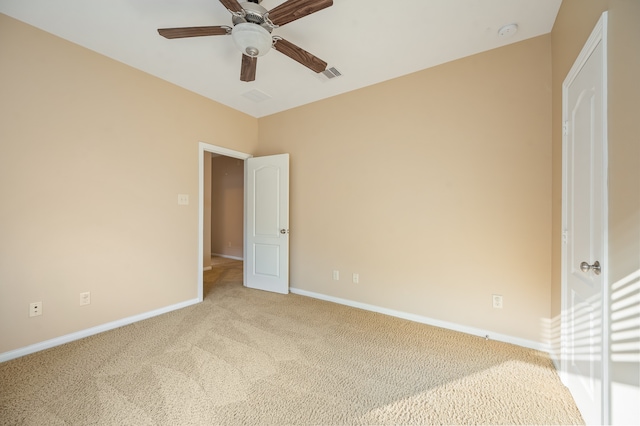 unfurnished bedroom featuring ceiling fan and light colored carpet