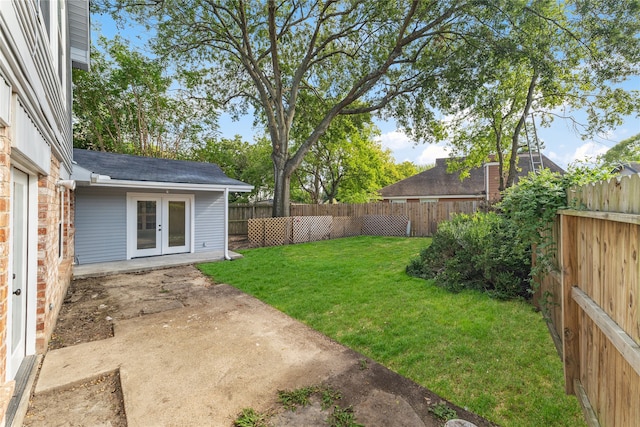 view of yard featuring french doors and a patio area