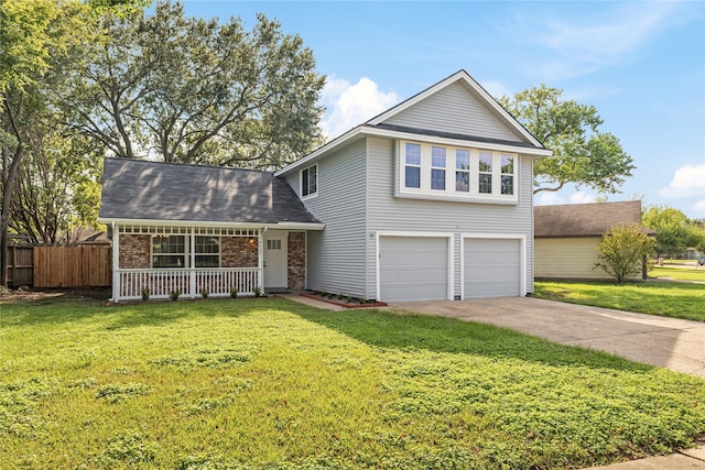 view of front property featuring a garage, a porch, and a front lawn