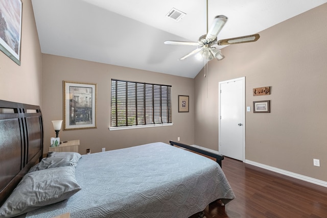 bedroom featuring lofted ceiling, dark wood-type flooring, and ceiling fan