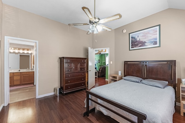 bedroom with lofted ceiling, ceiling fan, ensuite bathroom, and dark wood-type flooring