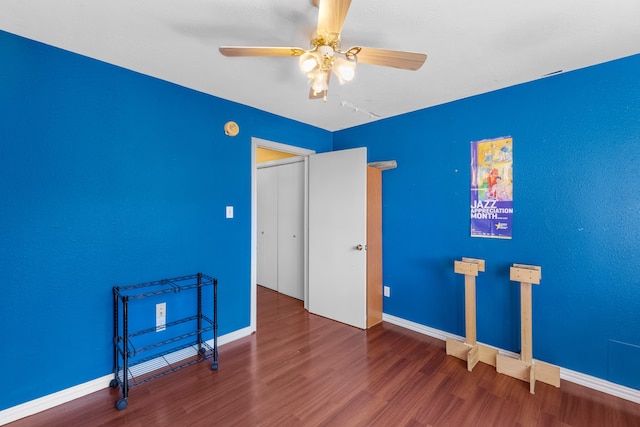 empty room featuring hardwood / wood-style floors and ceiling fan