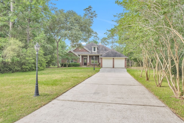 view of front of house featuring a garage and a front yard