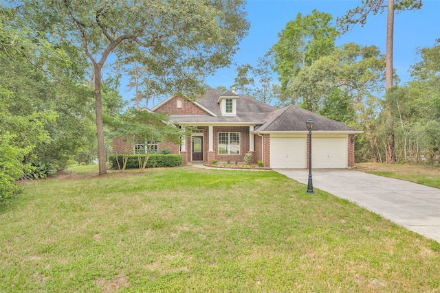 view of front of home with a front lawn and a garage