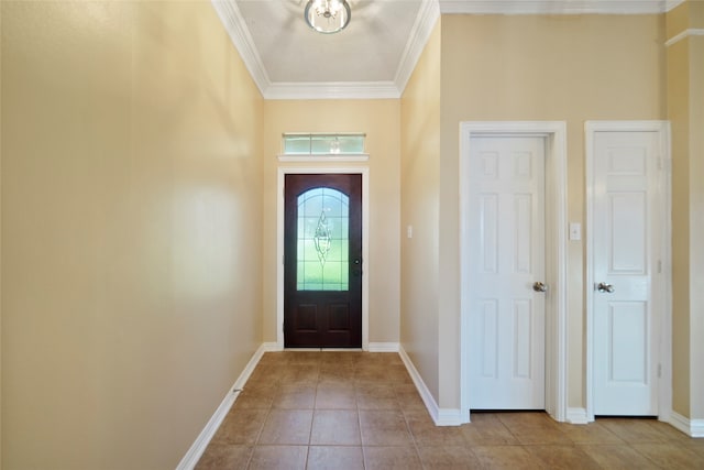 tiled entryway featuring ornamental molding