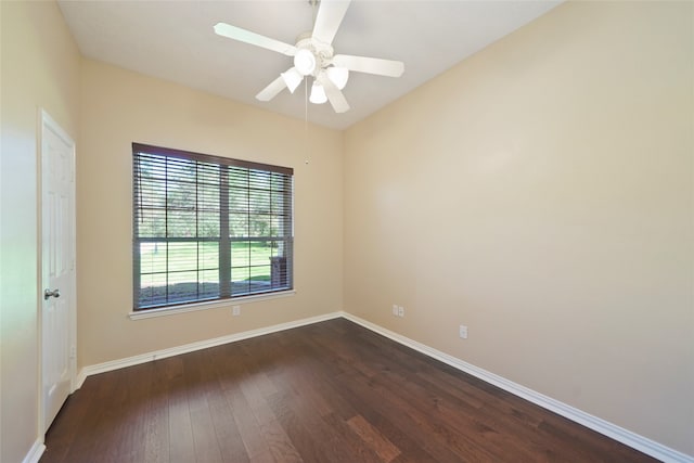 empty room with ceiling fan and dark wood-type flooring