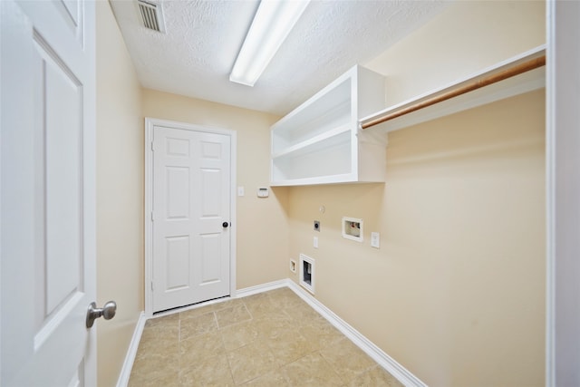 laundry area with washer hookup, light tile patterned floors, gas dryer hookup, a textured ceiling, and electric dryer hookup