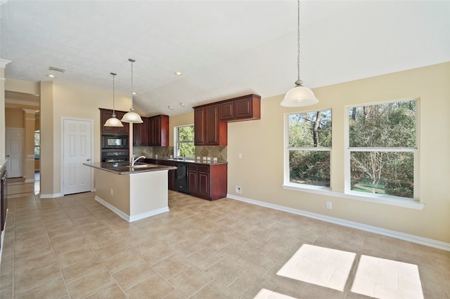 kitchen featuring black appliances, lofted ceiling, decorative backsplash, and a wealth of natural light