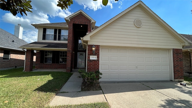 front facade featuring a front yard and a garage