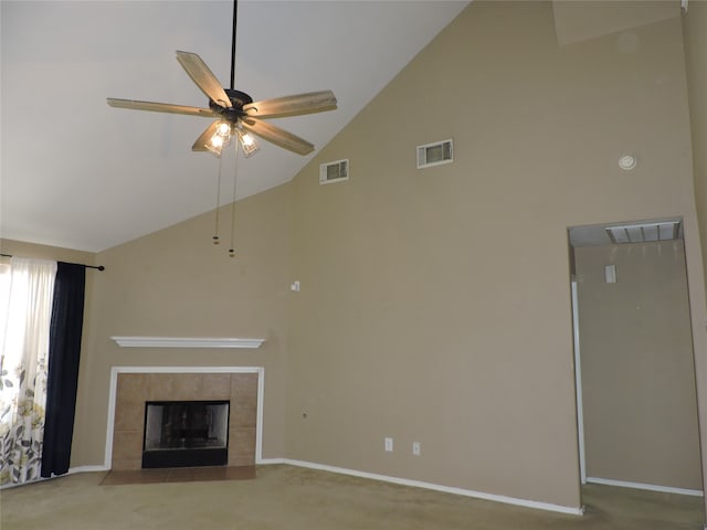 unfurnished living room featuring high vaulted ceiling, ceiling fan, a fireplace, and carpet flooring