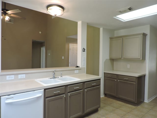 kitchen with dishwasher, sink, gray cabinetry, light tile patterned floors, and ceiling fan