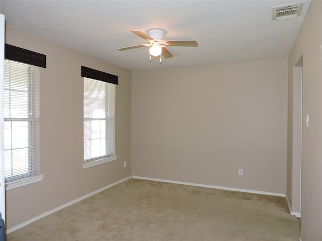 carpeted empty room with ceiling fan