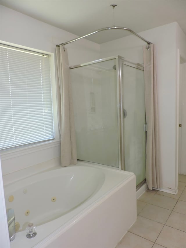 bathroom with plus walk in shower and tile patterned flooring