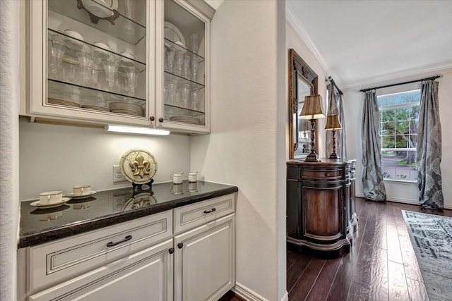 15026 Blossom Bay Dr, Houston, TX 77059 - bar featuring crown molding, baseboards, and dark wood-type flooring