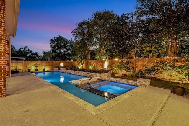 15026 Blossom Bay Dr, Houston, TX 77059 - pool at dusk with a fenced backyard, an in ground hot tub, a patio, and a fenced in pool