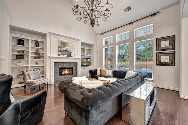 15026 Blossom Bay Dr, Houston, TX 77059 - living room featuring high vaulted ceiling, a notable chandelier, dark wood-style floors, and visible vents