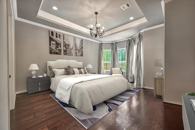 15026 Blossom Bay Dr, Houston, TX 77059 - bedroom with a notable chandelier, a raised ceiling, baseboards, visible vents, and dark wood-type flooring