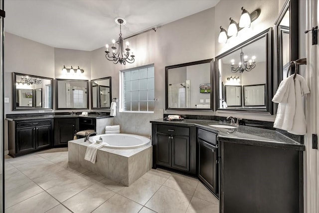 15026 Blossom Bay Dr, Houston, TX 77059 - full bathroom with a garden tub, a sink, a chandelier, and tile patterned floors