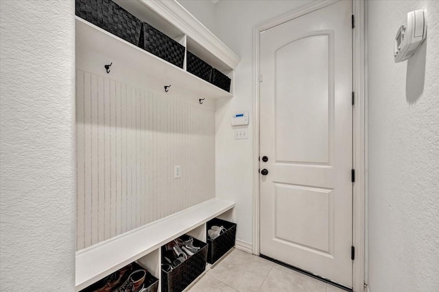 15026 Blossom Bay Dr, Houston, TX 77059 - mudroom with a textured wall and light tile patterned floors