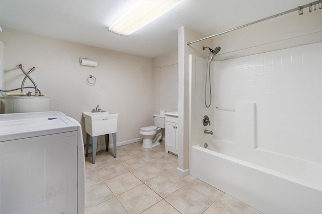 full bathroom featuring washer / clothes dryer, shower / bathtub combination, tile patterned floors, vanity, and toilet