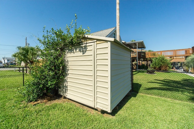 view of outbuilding featuring a lawn