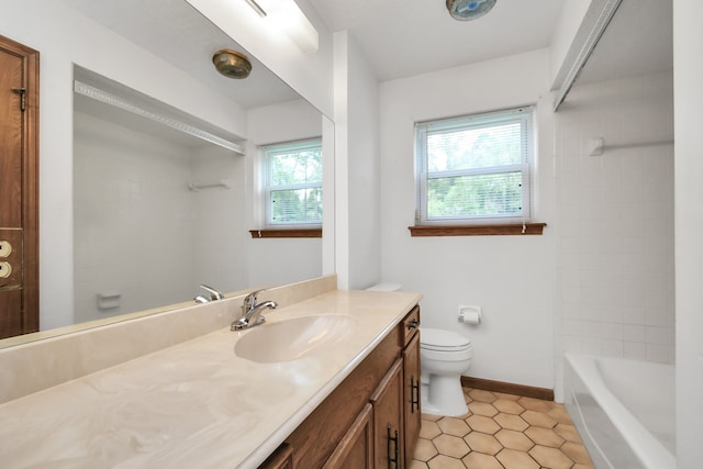 full bathroom featuring tile patterned floors, a wealth of natural light, vanity, and toilet