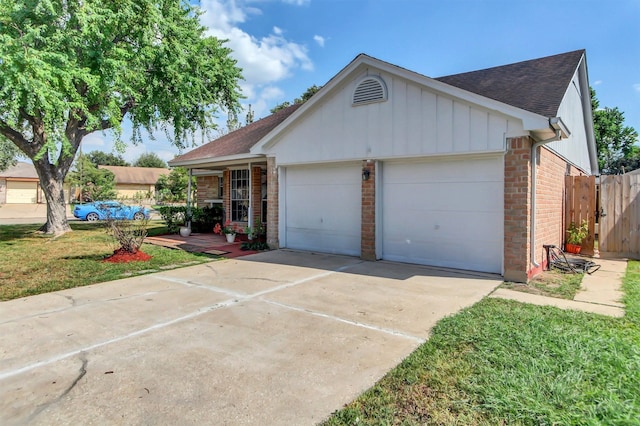 ranch-style home featuring a front yard and a garage