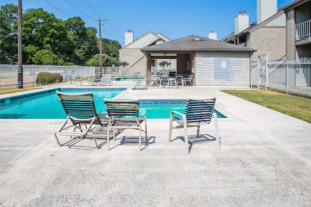 view of swimming pool featuring a patio