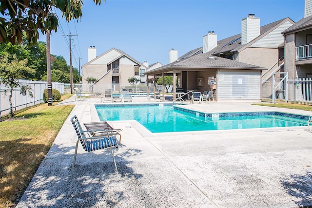 view of swimming pool with a patio