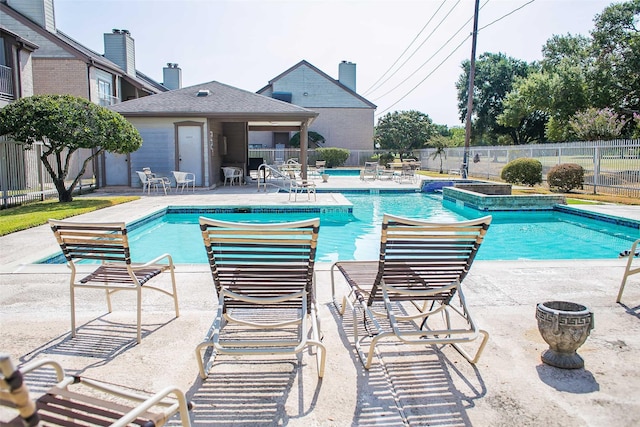 8235 Sands Point Dr Unit 156, Houston, TX 77036 - community pool with a fenced backyard and a patio area