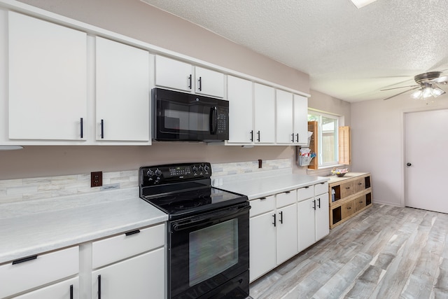 kitchen featuring black appliances, white cabinetry, light hardwood / wood-style flooring, and ceiling fan