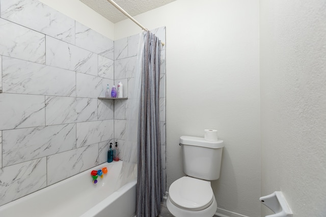 bathroom featuring shower / bath combo, a textured ceiling, and toilet