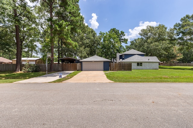 ranch-style home with a front yard, a garage, and a carport