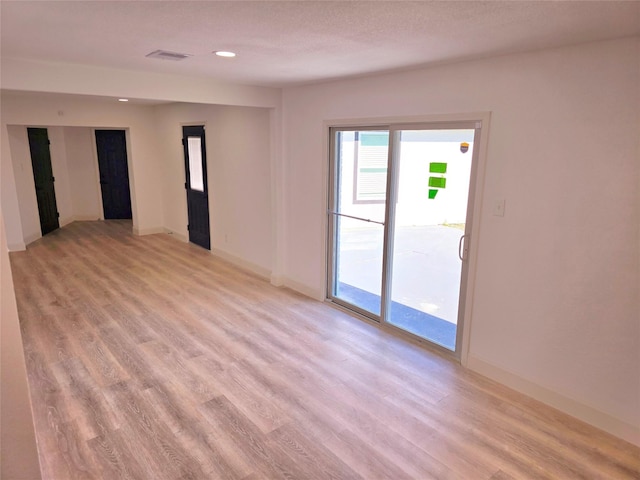 empty room featuring light hardwood / wood-style floors