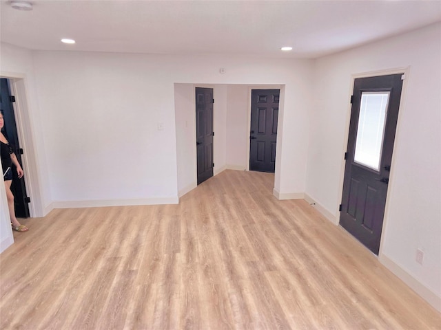 unfurnished room with light hardwood / wood-style flooring