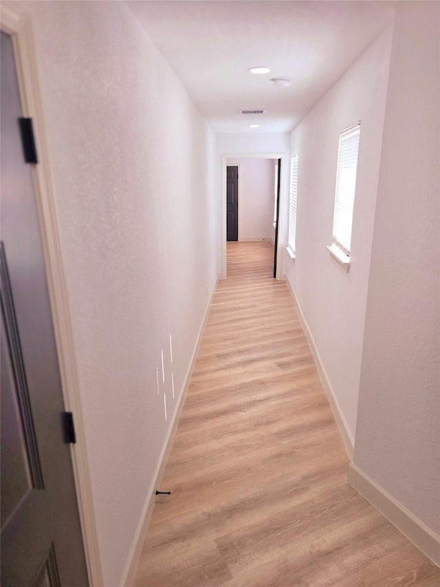 hallway featuring light hardwood / wood-style flooring