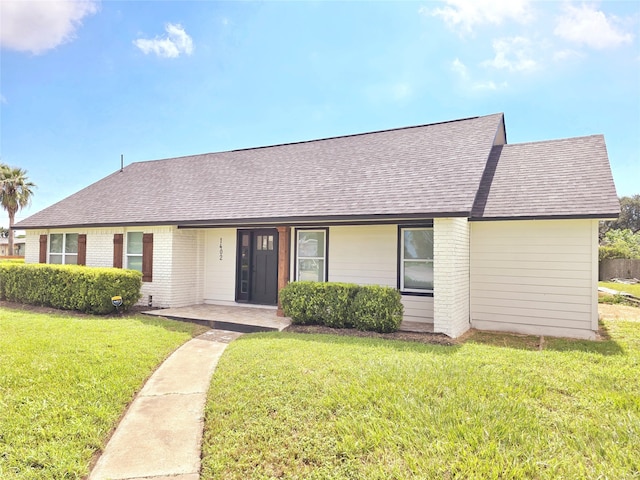 ranch-style house with a front yard