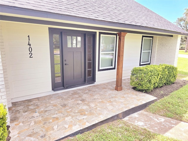 property entrance featuring covered porch