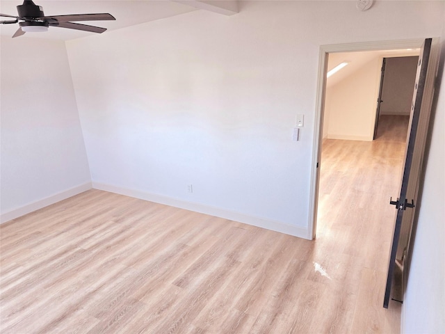 empty room with ceiling fan and light hardwood / wood-style flooring