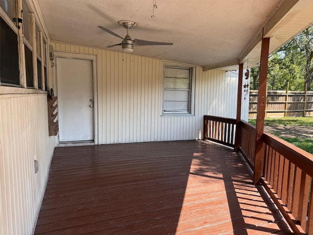 wooden deck featuring a ceiling fan