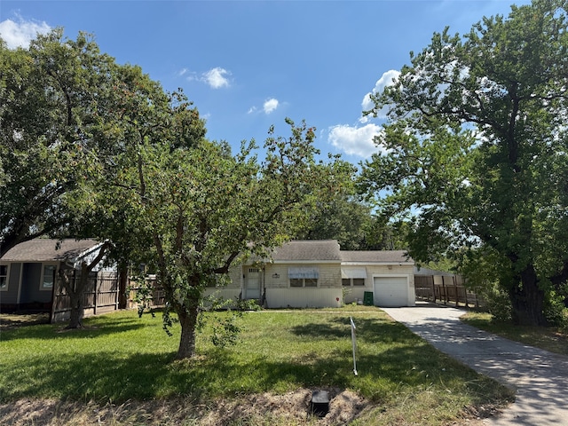 view of front facade with a front lawn and a garage