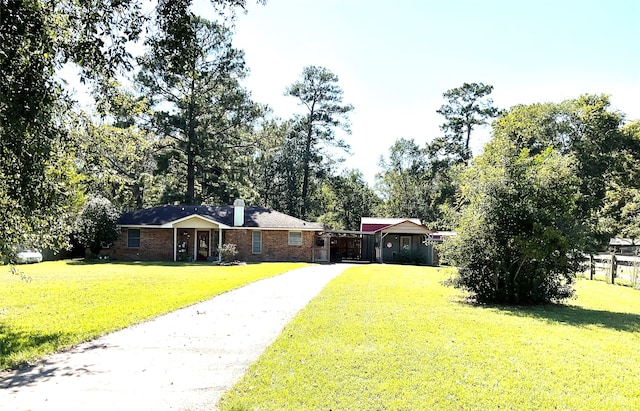 ranch-style home with a front yard